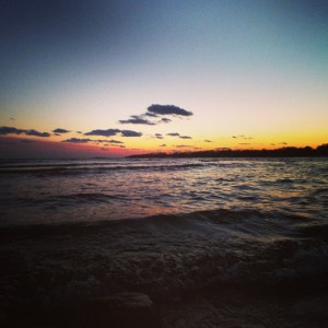 a sunset over a body of water