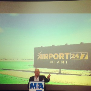 a man standing at a podium giving a presentation